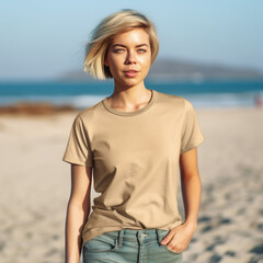 portrait of a beautiful smiling young white woman, model, with blonde  hair, wearing a cream t-shirt,on a beach, wearing jeans  lifestyle shot, relaxed, woman, person