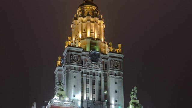 The Tower of Main Building of Moscow State University on Sparrow Hills at Winter Night Hyperlapse. Illuminated Landmark in the Heart of Moscow, Russia