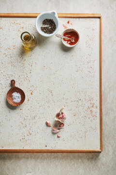 Coarse salt, oil, peppercorns, paprika powder and garlic