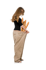 Slim young woman in oversized jeans showing weight loss results after healthy nutrition diet...