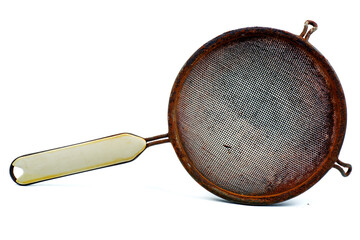 A used rusty broken sieve isolated on a white background.