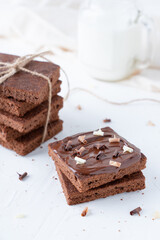 Chocolate brownies on a white background. Homemade cakes with chocolate and cocoa.