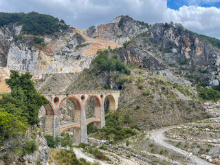 bridge over the river in the carrara marble mountains in italy