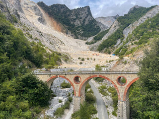 bridge in the carrara marble mountains in italy