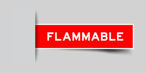 Red color square label sticker with word flammable that inserted in gray background