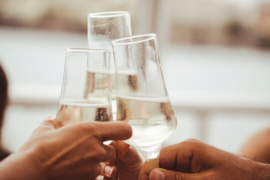 Friends raise glasses of champagne at a party