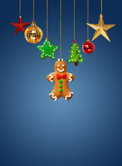 Christmas homemade gingerbread cookies and Christmas decorations on teal background..Christmas and New Year festive creative concept.