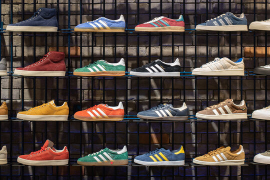 Store shelves with Adidas sneakers, including Gazelle, Campus, Stan Smith on September 2, 2023 in Bangkok, Thailand.