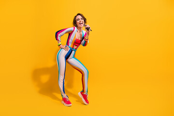 Photo of lady celebrity singing rock song in mic isolated vivid color background