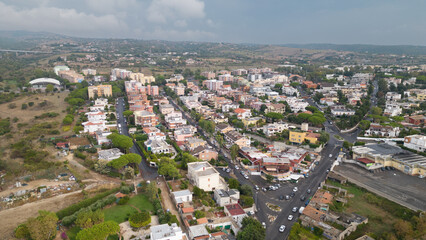 Aerial photo of an isolated road where cars pass. City landscape