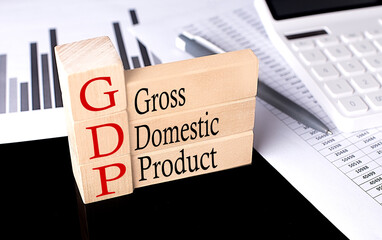 Word GDP made with wood building blocks, business concept