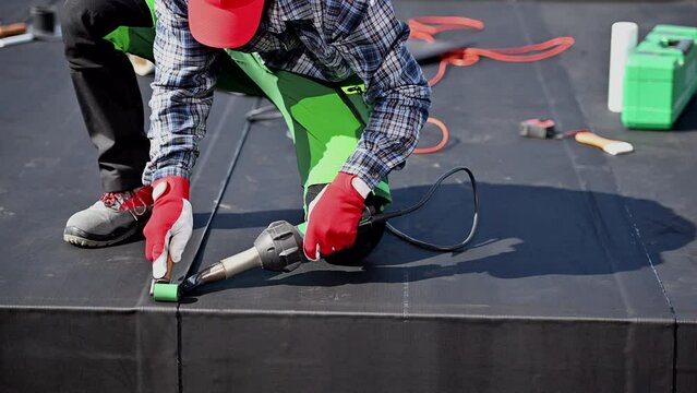Modern Roof Cover EPDM Rubber Installation Using Air Blower. Roofing Technologies.