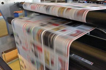 printing of coloured newspapers with an offset printing machine at a printing press company - 650269109