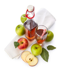 Apple Juice in Glass with Straw and Bottle Green Leaves Napkin isolated on white
