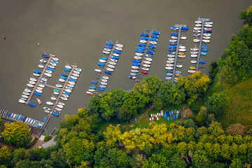Aerial view of the sailing marina in Haltern am See, Germany. Rows of small boats fixed on wooden...