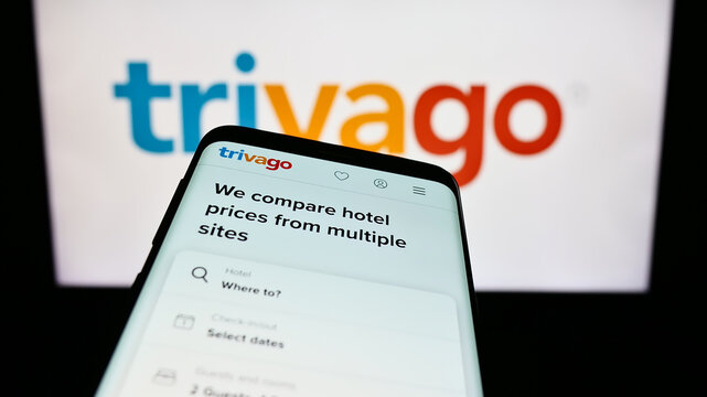 Stuttgart, Germany - 09-14-2023: Mobile phone with website of German hotel metasearch company Trivago N.V. on screen in front of logo. Focus on top-left of phone display.