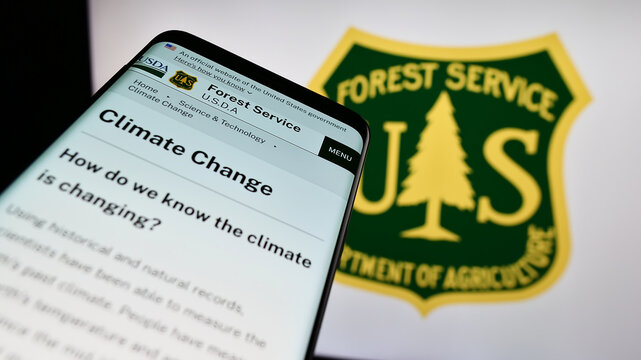Stuttgart, Germany - 09-17-2023: Mobile phone with webpage of United States Forest Service (USFS) on screen in front of logo. Focus on top-left of phone display.