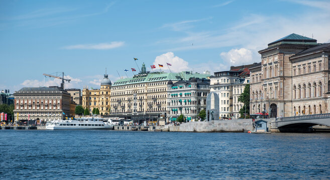 Stockholm, Sweden. Waterfront building at Strandvagen embankment in Ostermalm district. Moored boat