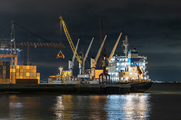 Glowing cargo seaport at night