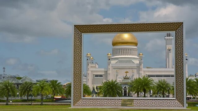 The late afternoon sun sets over Bandar Seri Begawan, Brunei, and strikes the facade of the Sultan Omar Ali Saifuddin Mosque.