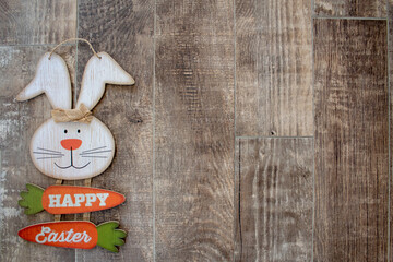 Easter bunny on wooden background with copy space, Happy Easter.