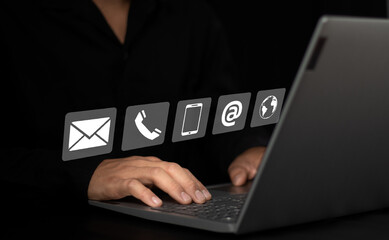 Man using laptop to search the web, find information, contact, have a home office concept contact us.