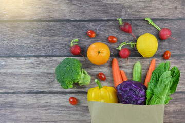 Healthy food background, healthy vegetarian food in paper bags, fruits and vegetables, banner copy...