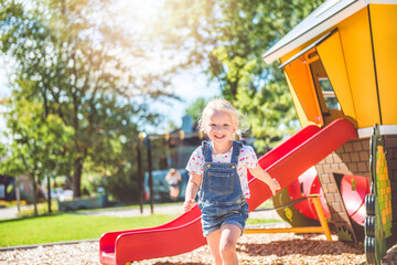 Happy kid on playground on summer season