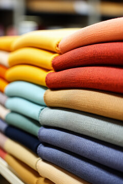 Detailed fabric patterns in a textile factory background with empty space for text 