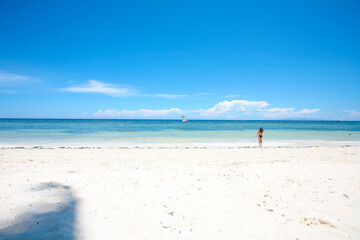 Beautiful beach with blue waters, white sand and clear sky at Alona Beach, Bohol, Philippines.
