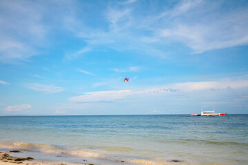 Beautiful beach with blue waters, white sand and clear sky at Alona Beach, Bohol, Philippines.
