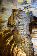 Interior of a deep cave with its columns and rock formations in Lagoa Santa in the state of Minas Gerais, Brazil
