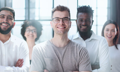 Smiling professional business leaders and employees group team portrait