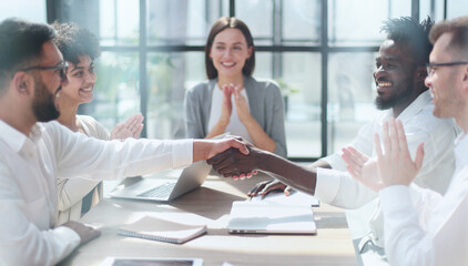 Fototapeta premium Congratulating the new partners in modern office