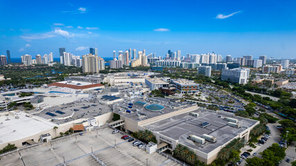 Aventura, Florida, USA - Aerial of Aventura Mall, with skyline of Sunny Isles Beach in the distance.