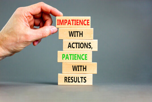 Action And Result Symbol. Concept Words Impatience With Actions Patience With Results On Wooden Block. Beautiful Grey Table Grey Background. Businessman Hand. Business Action Result Concept.