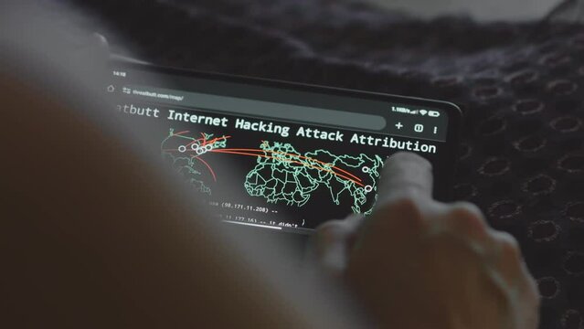 Global cyber attack with world map on mobile phone screen. Internet network communication under cyberattack. Worldwide propagation of virus online. Closeup.