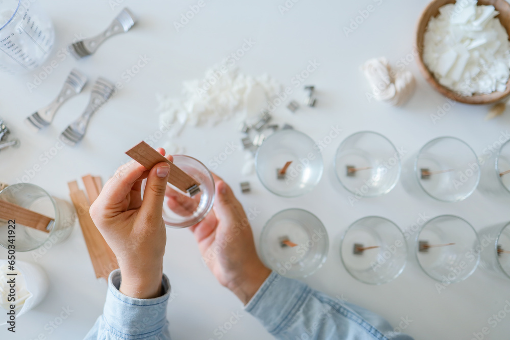 Wall mural Process of making candles in a workshop