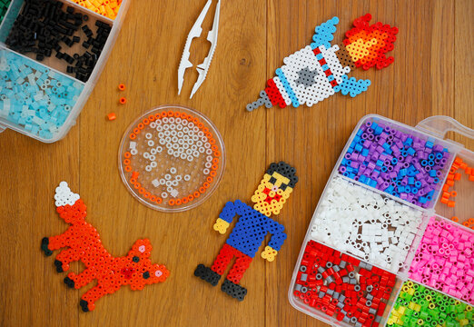 Set Of Perler Beads Perler Pegboard Tweezers And Many Colorful Fusible  Beads Toy That Develops The Imagination Of Child Childrens Toys Theme Wide  Background With Space Stock Photo - Download Image Now 