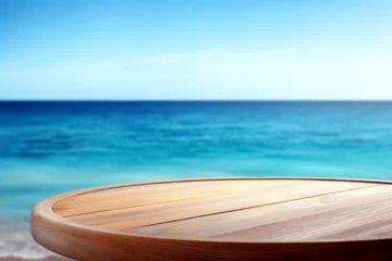 Rolgordijnen Round wooden table with the beautiful blue ocean and sky in the background. Perfect for presenting products like food or beverages. Generative AI © mr_marcom