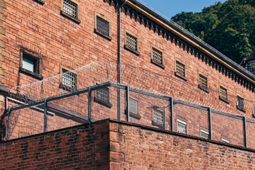 a prison with barbed wire