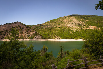Lake Fiastra, a fantastic landscape, bathed by water - 650367319