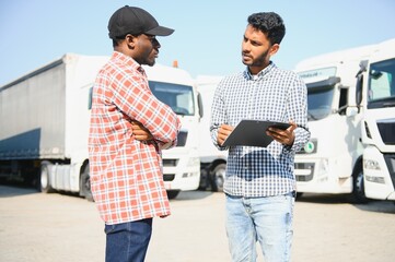 Logistics manager controlling truck driver schedule