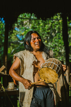 Ethnic man playing traditional drums