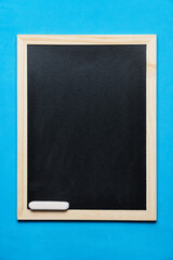 Fototapeta premium Chalkboard with chalk on bright blue background.
