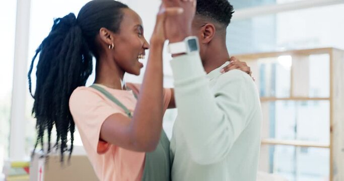 Dance, happy couple and celebrate moving to new house, real estate investment or freedom of financial security. Excited black people in home for energy, celebration or mortgage loan for property rent