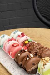 Set of colored macaroons with decoration and fondant. Sweet food concept