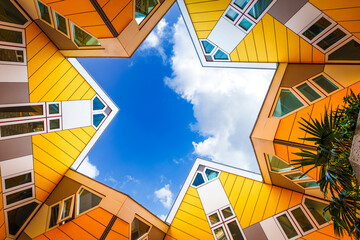 Spectacular Urban Landscape, Vibrant Yellow Cube Houses in Rotterdam, a Modern Architectural Marvel and Tourist Attraction in the Netherlands - obrazy, fototapety, plakaty