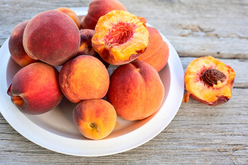 Fresh organic bio peaches on wooden background