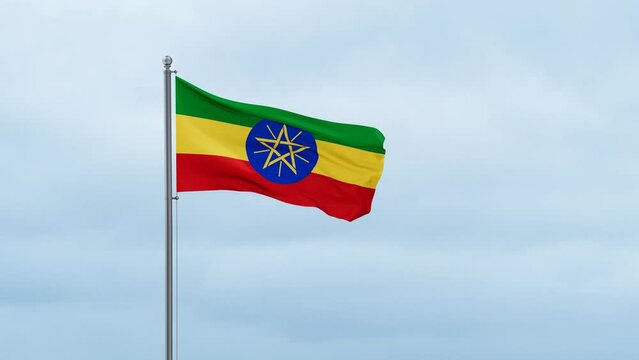 Ethiopia flag waving in the wind, cloudy blue sky with running clouds, endless seamless loop